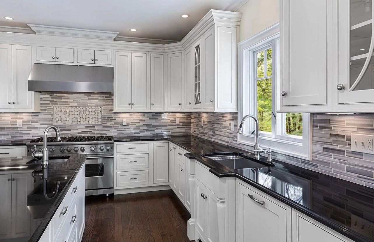 Bright white shaker kitchen after whole-home renovation by Green Tech Remodeling